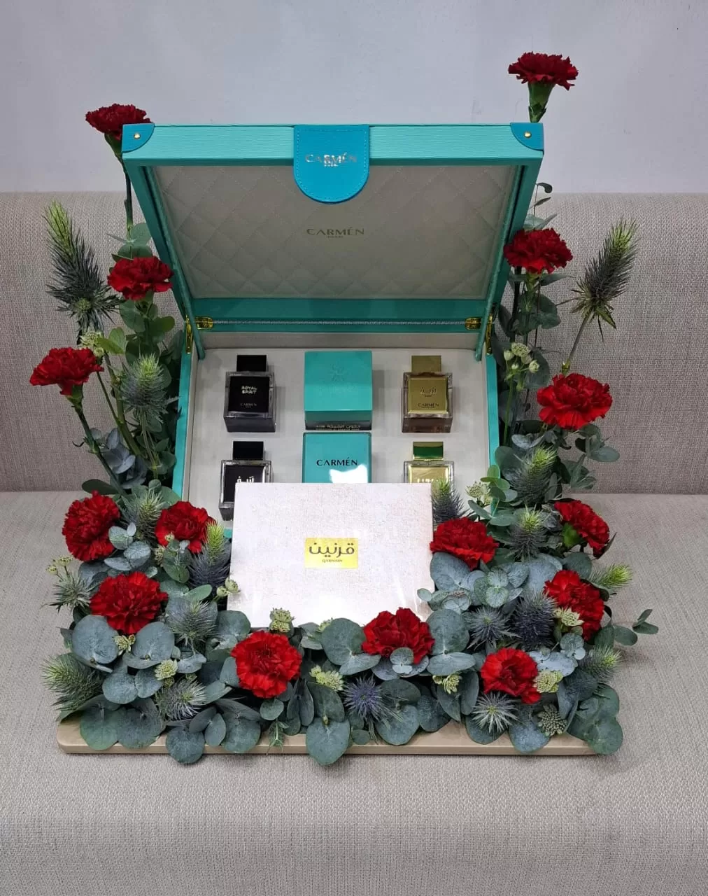 Gold perfumes flowers arrangement