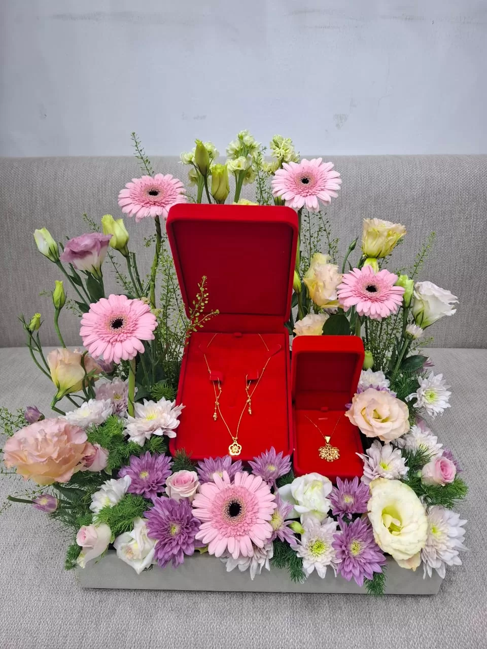 Gold perfumes flowers arrangement